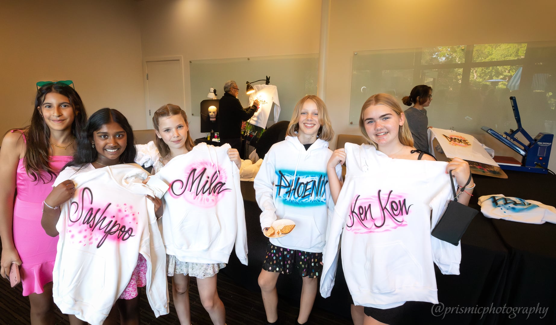 Children pose with named sweatshirts at a bat mitzvah