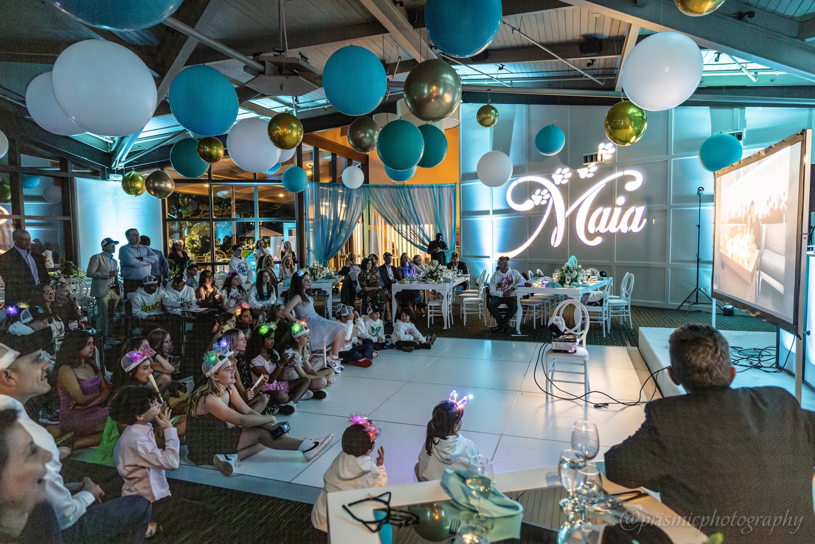 Children watch a movie at a bat mitzvah