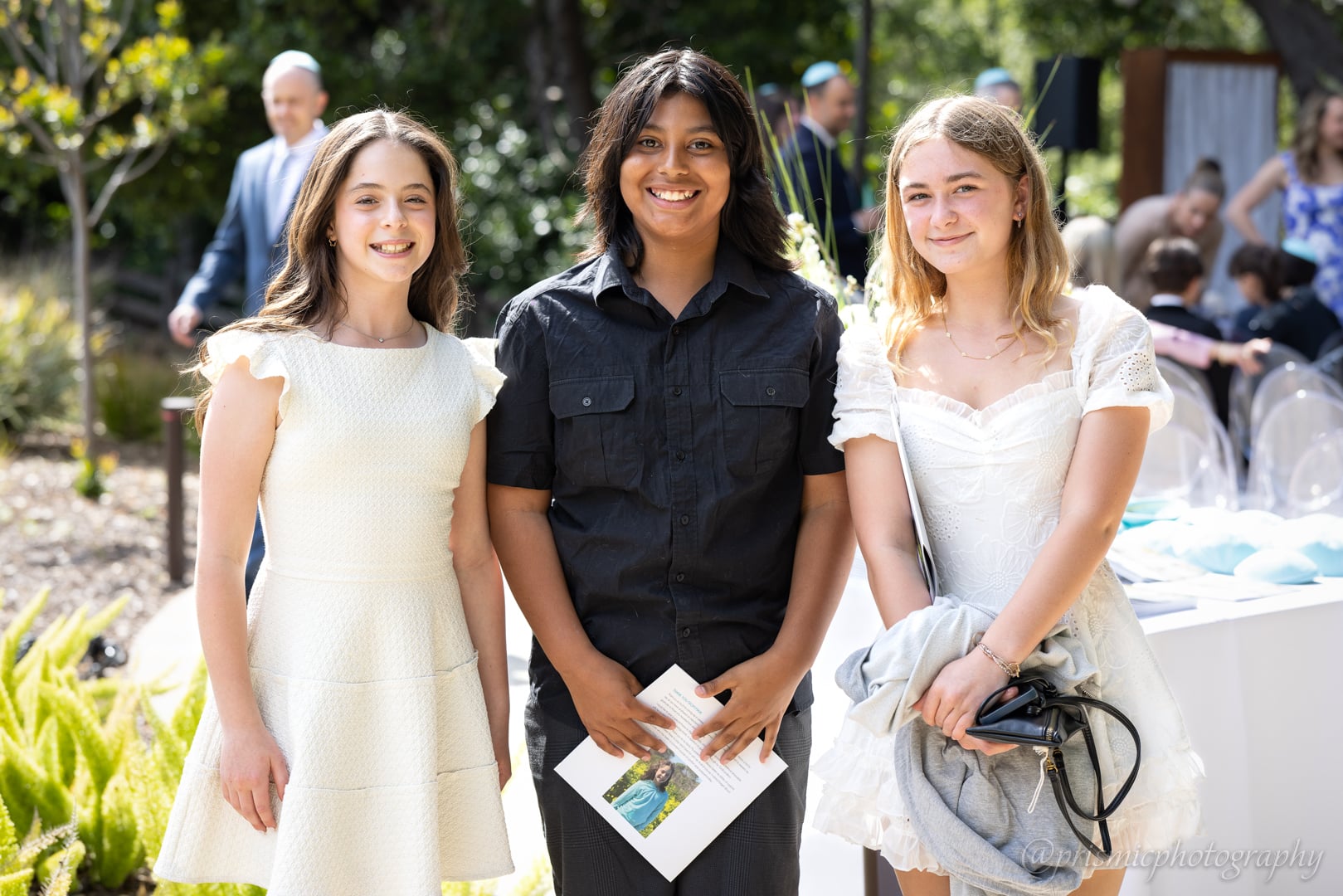 A posed photo of smiling children at a bat mitzvah